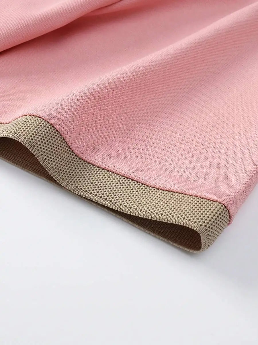 Pink Short-Sleeve Polo Shirt with Contrast Collar and Embroidered Text Design