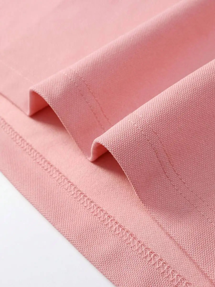 Pink Short-Sleeve Polo Shirt with Contrast Collar and Embroidered Text Design