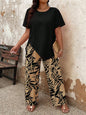 2pcs Plus Size Women Solid Asymmetric Hem Top & Tropical Plants Print Pants