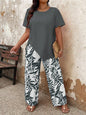 2pcs Plus Size Women Solid Asymmetric Hem Top & Tropical Plants Print Pants
